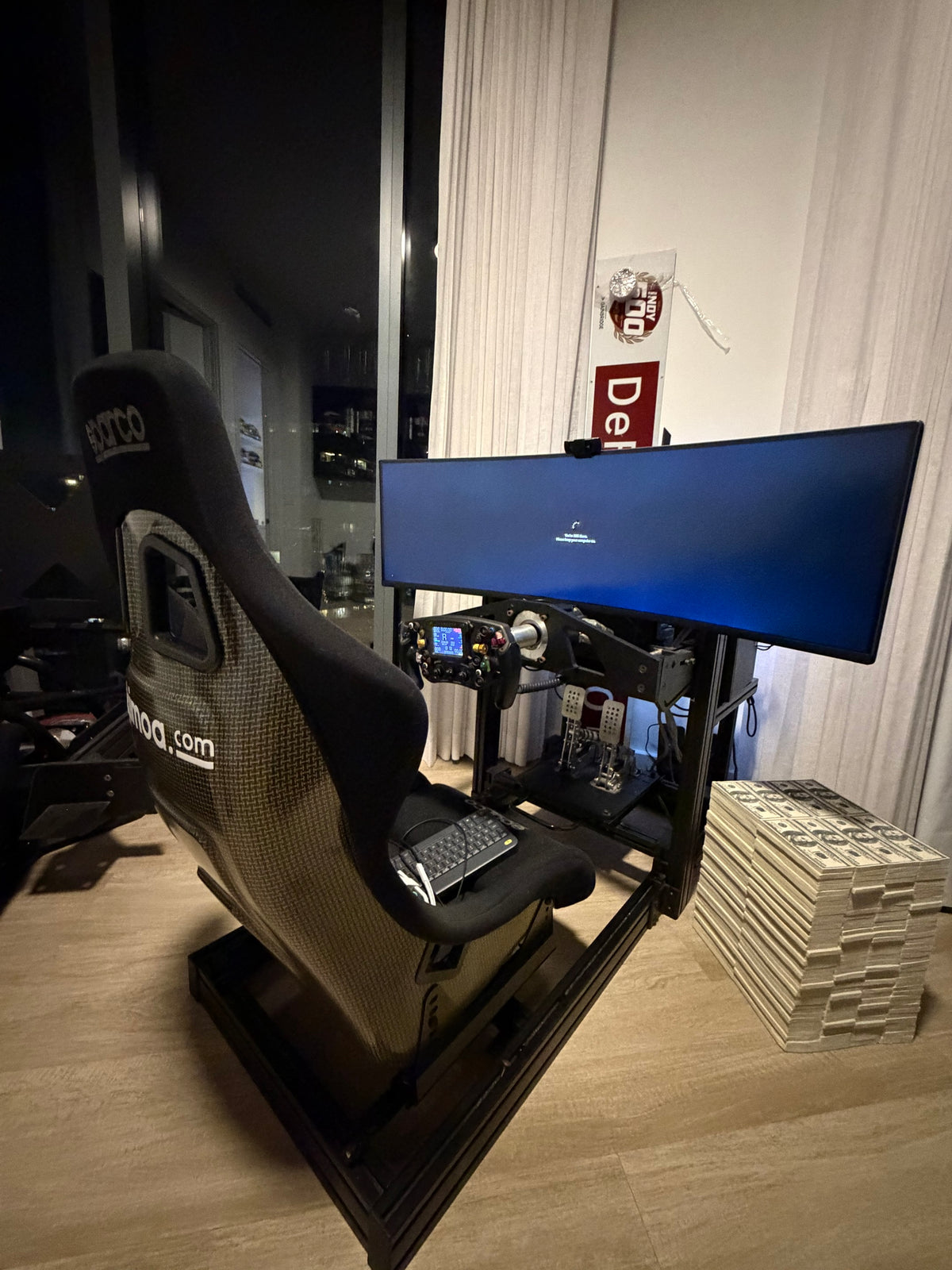 Completed sim racing build in the GT seating position with a formula wheel, two pedal set and a curved ultrawide screen
