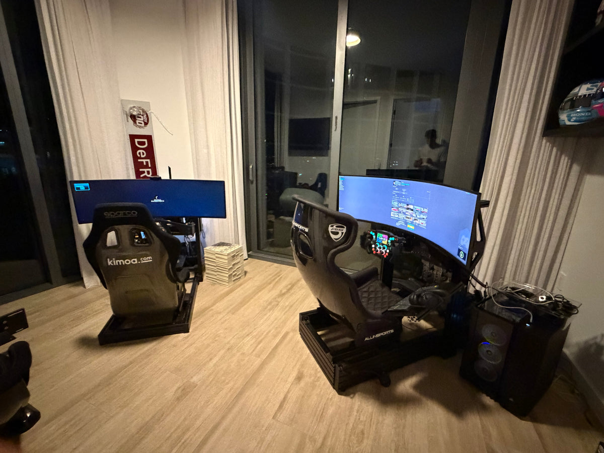 Two completed sim racing builds side by side in one room, both in the GT seating position with curved ultrawide screens